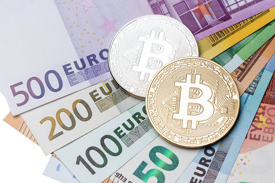 Bitcoins on money bills background.