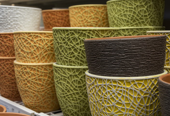 On a shelf of clay pots for flowers