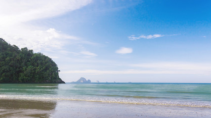 Wave of the sea on the sand beach, Beach and tropical sea, Paradise idyllic beach Krabi, Thailand, Summer holidays, Ocean in the evening as nature travel background.