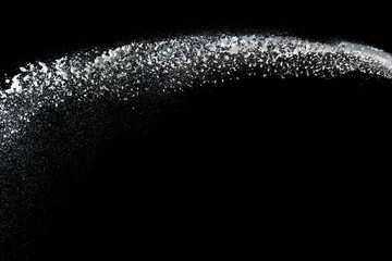 Freeze motion of white powder explosions isolated on black background