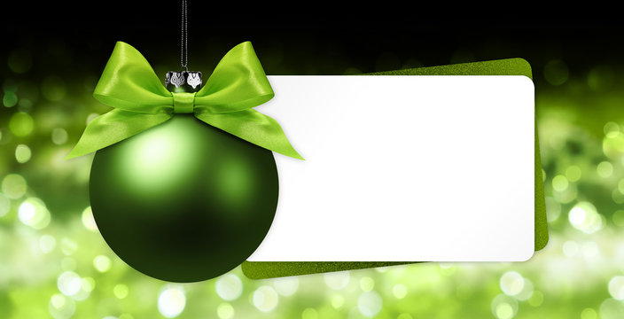 Greeting Gift Card With Green Christmas Ball On Blurred Lights Background White Template Copy Space