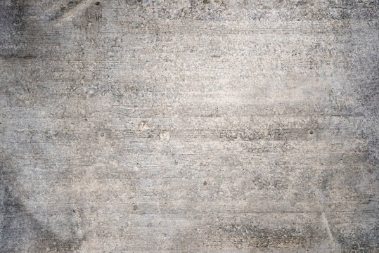 Old concrete wall with wood grain as background
