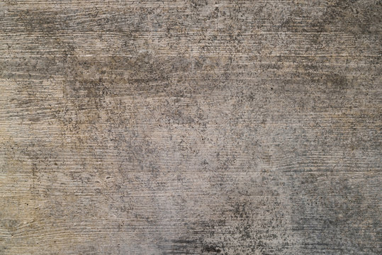 Old concrete wall with wood grain as background