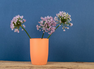 Wildflowers in a vase on a wooden table