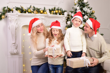 Happy family with two children celebrate New year, Christmas