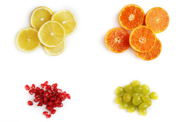 set of fruits of mandarin, grapes, lemon, pomegranate on white b