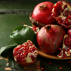 Juicy pomegranates closeup on plate