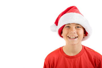 Happy teenage boy wearing a Christmas hat