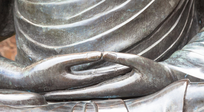 Detail of Buddha statue with Dhyana hand position, the gesture of meditation