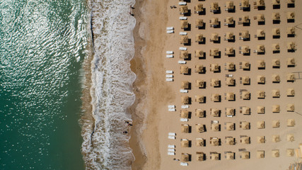 Fototapeta na wymiar Top view of beach with straw umbrellas. Golden sands, Varna, Bulgaria