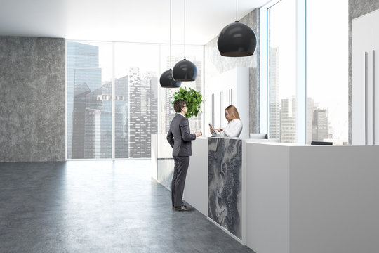 Concrete and marble office, reception side, people