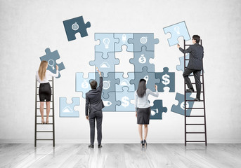 Business team on ladders, business puzzle