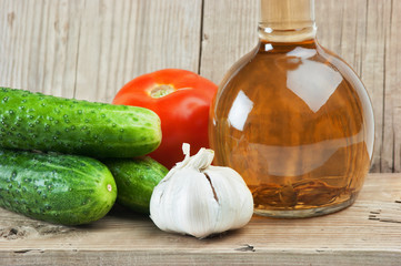 vegetables and a bottle of oil, still life