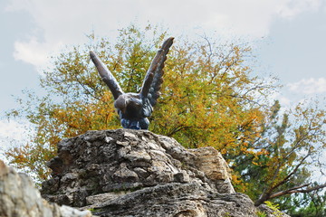 The bronze sculpture of an eagle fighting a snake on a Mashuk mountain. Pyatigorsk, Russia. This is a official symbol of the Caucasian Mineral Waters. This monument was opened in 1901