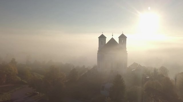 Beautiful Cathedral backlight by the morning sun on a foggy day. 