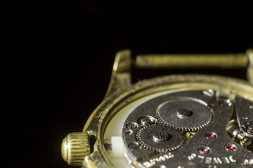 old clock mechanism close-up, back and front background blurred