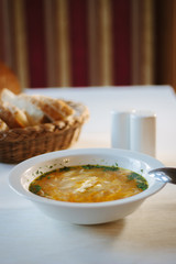 Nice vegetable soup at the table of restaurant.