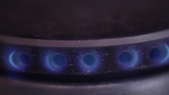 Close up view of blue flame of natural gas. Slow motion