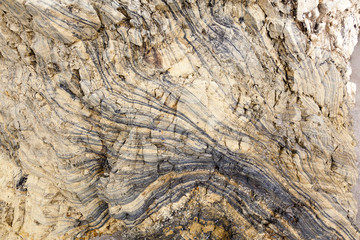 textures of layers of minerals of different brown colors