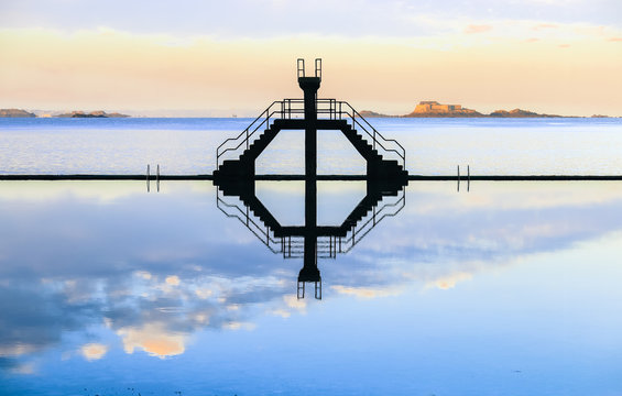  Diving board reflection on sea water swimming pool in Saint Malo, France