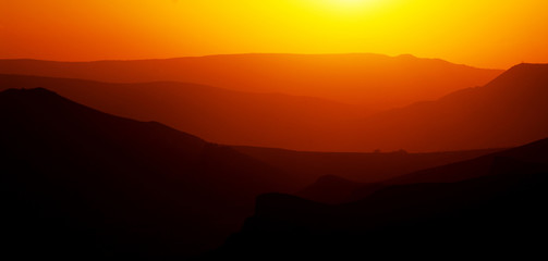 Fototapeta premium sunset in the mountains, layered red