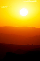 sunset in the mountains, layered red