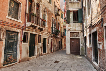 Fototapeta na wymiar Narrow street in the old town in Venice Italy