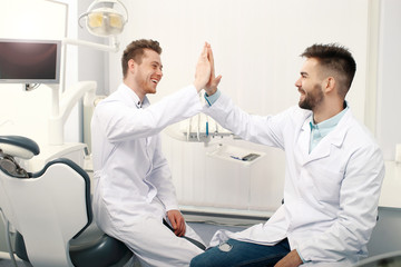 Fototapeta premium Two male dentists in clinic