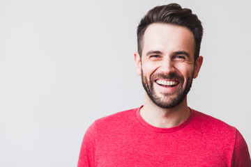 Portrait of a handsome young man laughing