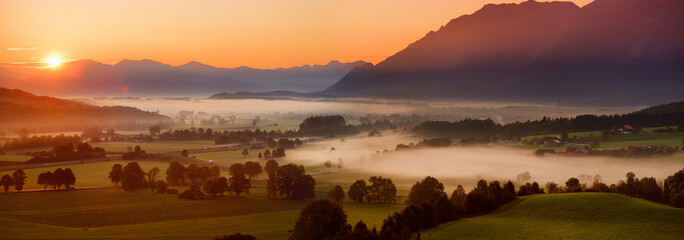 Breathtaking morning lansdcape of small bavarian village covered in fog. Scenic view of Bavarian...