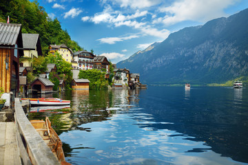 Scenic view of Hallstatt lakeside town in the Austrian Alps in beautiful evening light on beautiful...