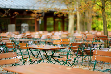Empty outdoor cafe on beautiful autumn day in Munich, Germany.