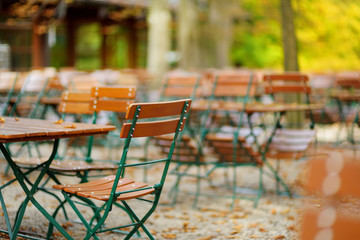 Empty outdoor cafe on beautiful autumn day in Munich, Germany.