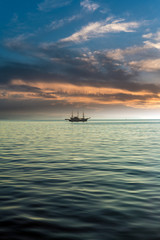 Minimalistic Scene of Sea and Boat, under Sunset Colors Sky
