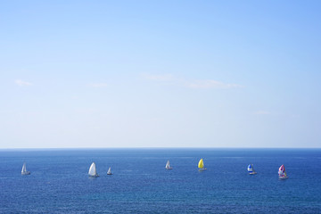 Yacht on the sea horizon on a summer day