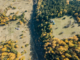 Aerial view of cottage in Swiss mountains in fall season