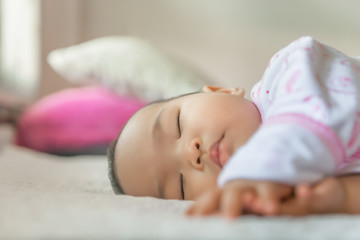 Obraz na płótnie Canvas Asian cute baby girl sleep on the bed,thailand people,time for relax