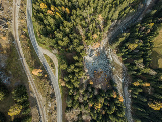 Aerial view orailway track and road in mountain valley in Switzerland