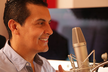Attractive adult preparing for a Radio Morning Session