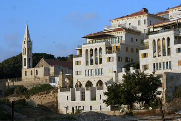 Fototapeta na wymiar Church of St. George in Old Jaffa and new residential buildings area