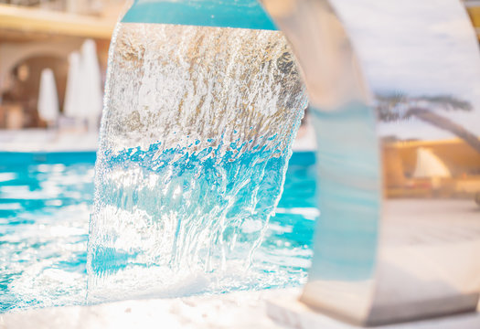 Water stream into swimming pool