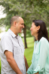 Fototapeta premium Happy couple smiling and hugging.
