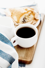 Morning coffee with croissant on the table