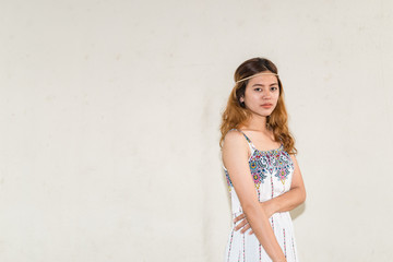 Naklejka premium Portrait of asian bohemian girl on white wall,thailand people,hippie girl