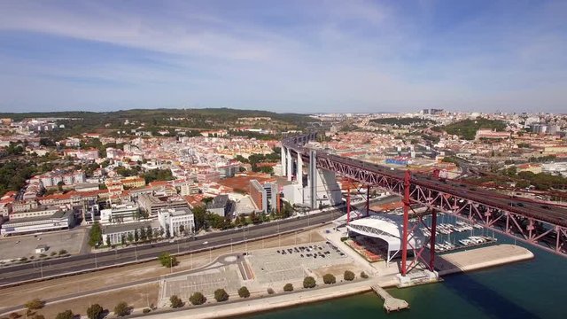 Lisbon, Portugal, aerial view of traffic on Ponte 25 de Abril bridge and LX Factory area.