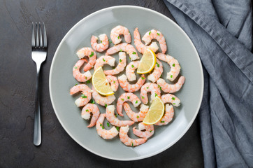 Roasted peeled prawns in a garlic and ginger sauce with herbs an