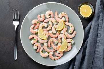 Roasted peeled prawns in a garlic and ginger sauce with herbs an