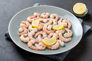 Roasted peeled prawns in a garlic and ginger sauce with herbs an