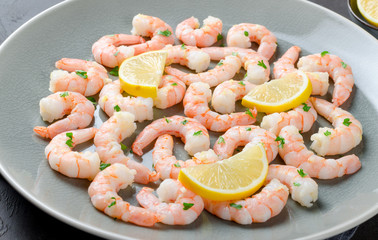 Roasted peeled prawns in a garlic and ginger sauce with herbs an