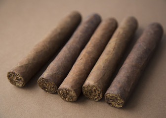 Close-up Five Cigars on Dark Background Natural Light Selective Focus
